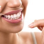 closeup the importance of flossing