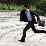 busy businessman dental patient running to appointment