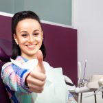 happy woman at dental clinic