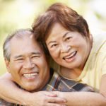 Older couple wearing affordable dentures