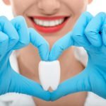 dentist explaining link between heart disease and gum disease