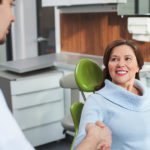 woman discussing deep cleaning with the dentist