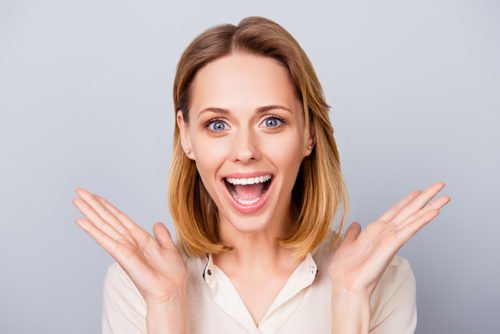 Happy Surprised Young Lady Laughing