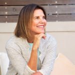 smiling older woman with perfect teeth dentures