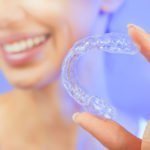 Smiling Girl with Tooth Tray