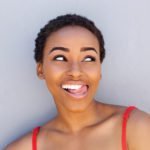 Happy Young Woman Sticking Tongue Out