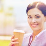 woman sipping sugary drink latte
